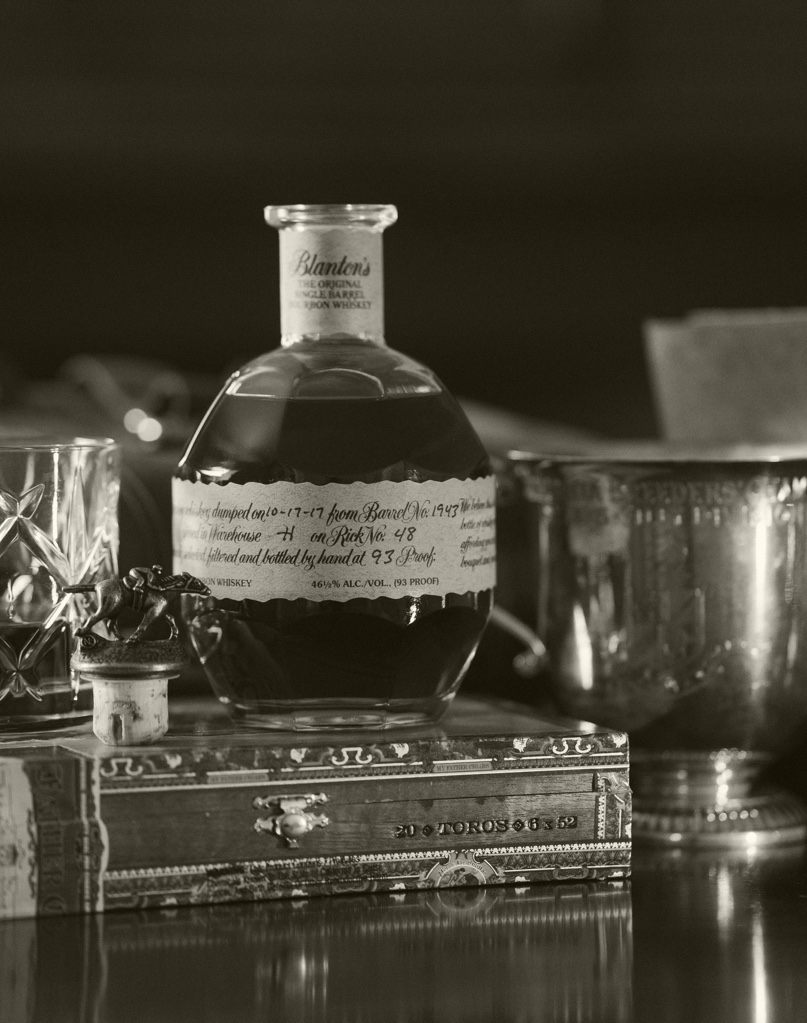 A black and white overlay of a 1 liter bottle of Blanton's Original Bourbon Whiskey