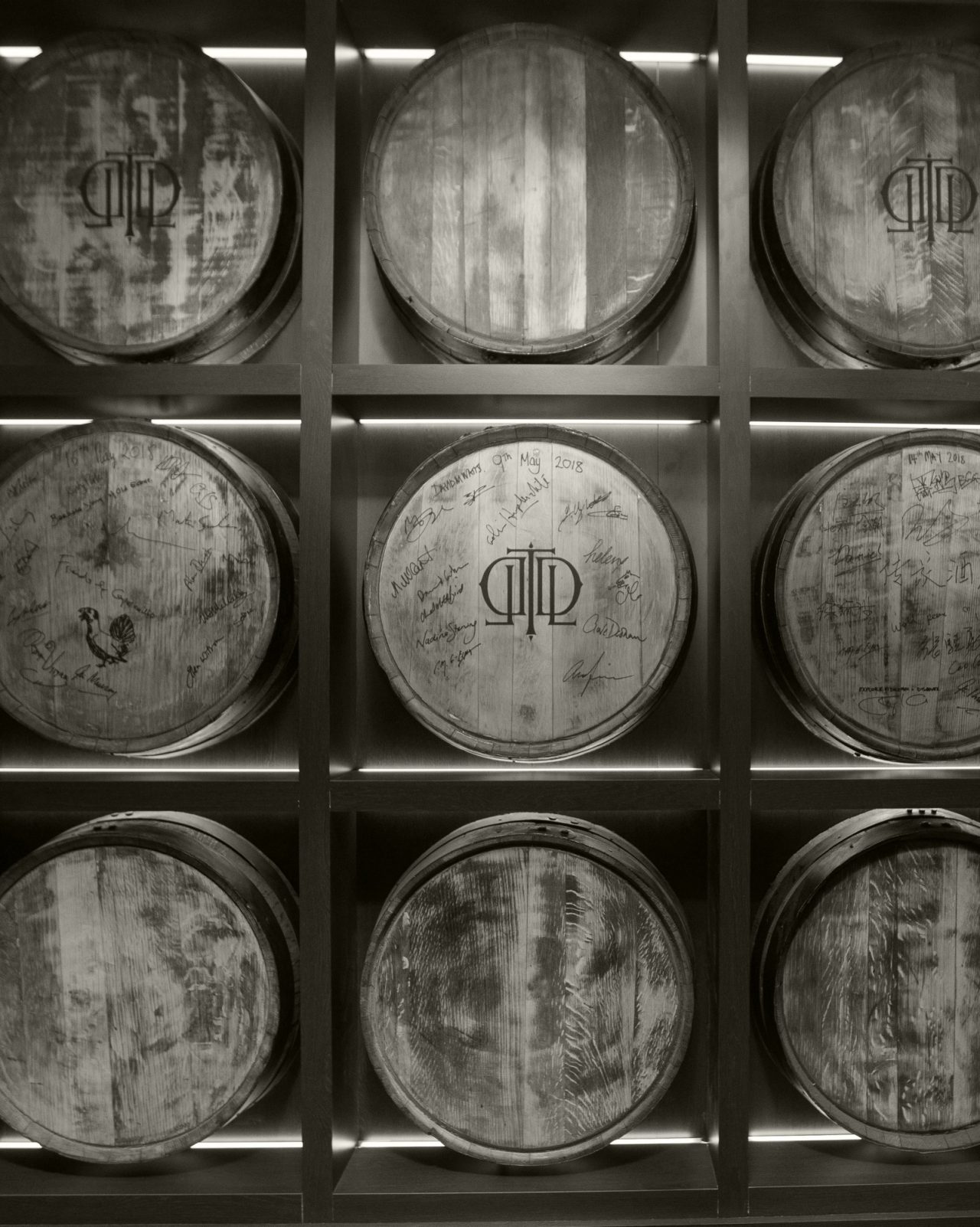 Black and white wall of Last Drop barrels