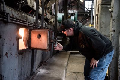 Checking equipment at Barton Distillery