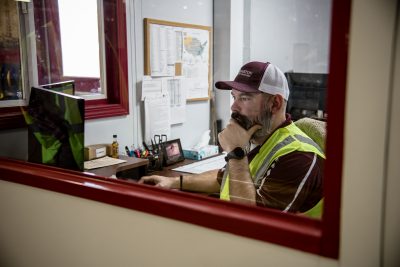Male working on computer in manufacturing office