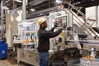 Adjusting equipment at Boston Brands of Maine