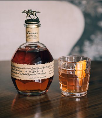 Blanton's bourbon bottle and old fashioned in glass