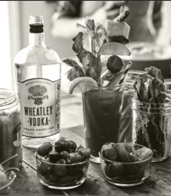 Black and white Wheatley vodka bottle and bloody mary with garnish