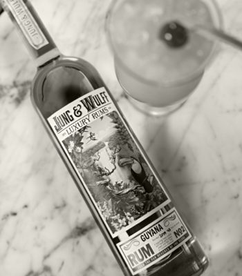 Black and white Jung & Wulff bottle with Hurricane cocktail