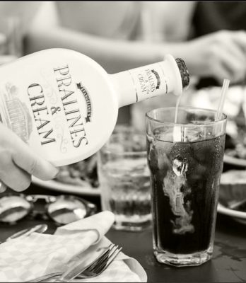 Black and white Pralines & Cream being poured into glass