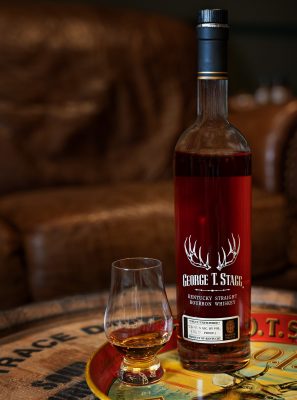 Download Bottle of George T. Stagg and glass on tray on barrel