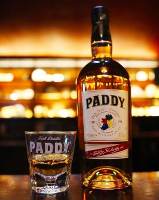 Download A glass and bottle of Paddy Irish Whiskey