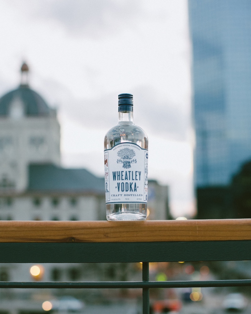 A focused photograph of Wheatley Vodka's 750 milliliter bottle sitting on a ledge