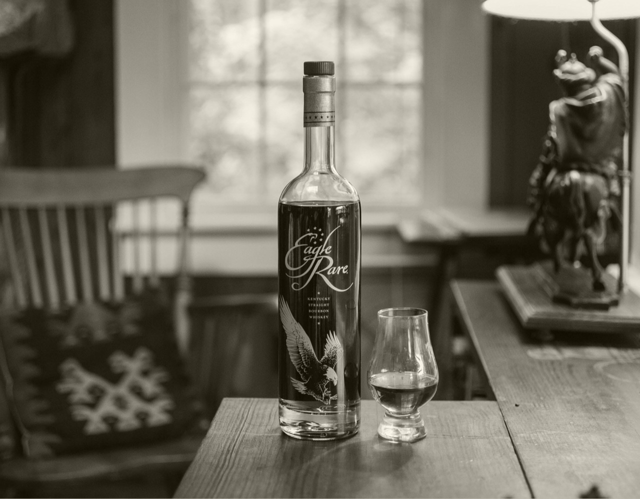 Black and white Eagle Rare Bottle and Glass on table