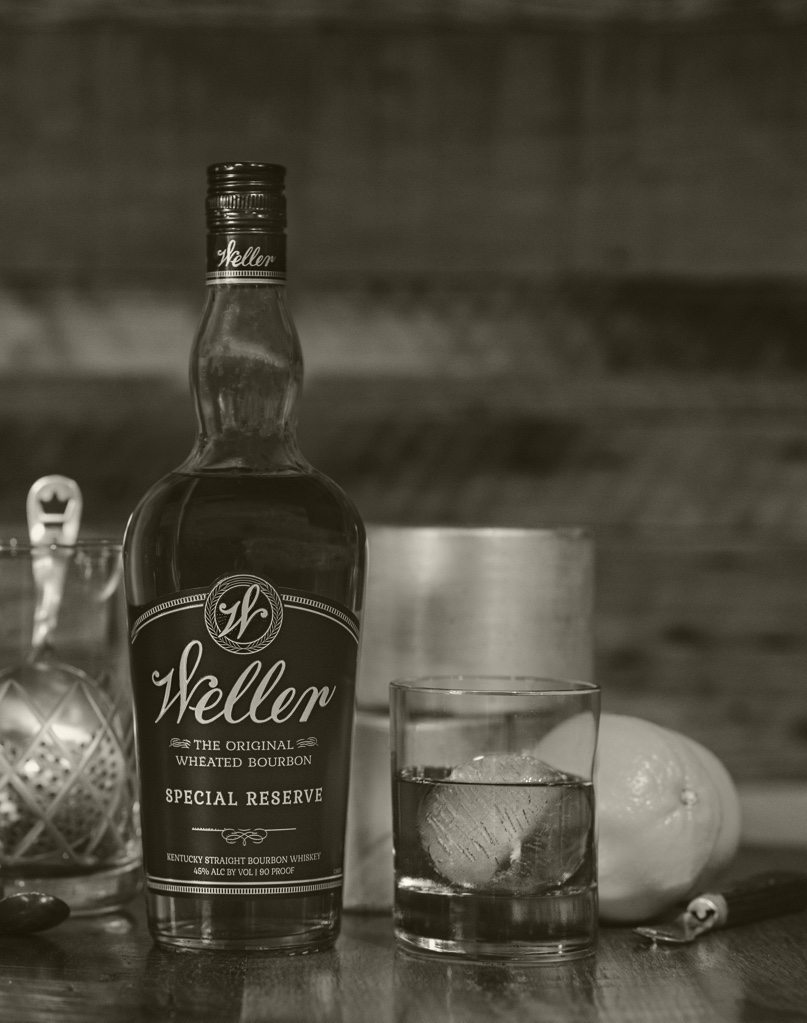 A sepia toned photo of a 1 liter bottle of Weller Bourbon Special Reserve