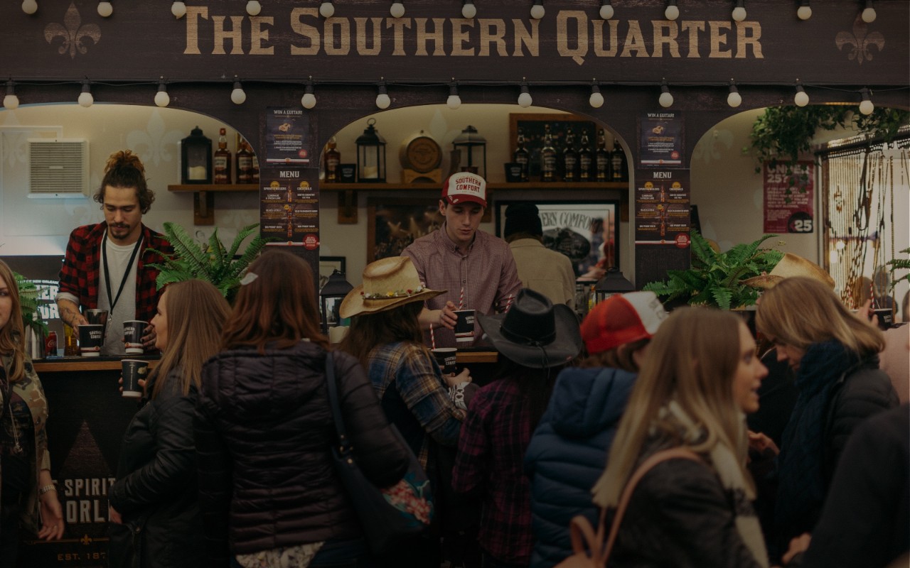 People getting drinks served to them at The Southern Quarter bar.