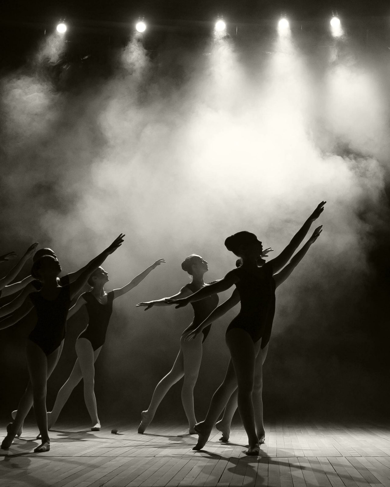 Black and white picture of six young ladies during a ballet recital
