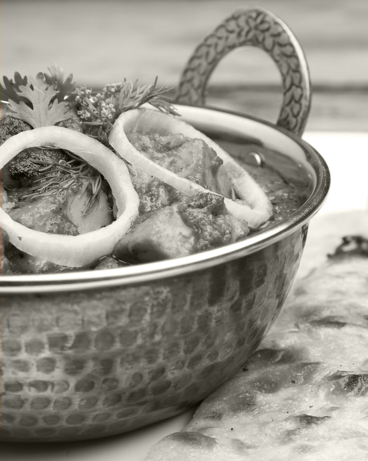 Black and white closeup on a fancy seafood dish on a table